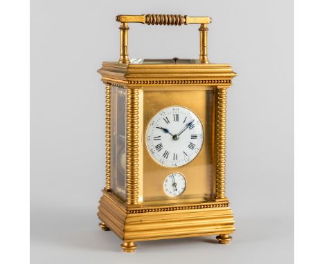 A FRENCH GILT BRASS STRIKING AND REPEATING LEVER CARRIAGE CLOCK WITH ALARMCirca 1890The case with a ring-turned handle above 