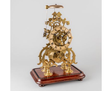 A VICTORIAN BRASS SKELETON TIMEPIECE WITH ONE-IN-PASSING STRIKECirca 1880, later base and glass domeWith scrolled pierced fra