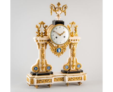 A LATE LOUIS XVI ORMOLU, PORCELAIN-MOUNTED MARBLE MANTEL CLOCKCirca 1790Surmounted by an urn with berried fruit garlands, abo