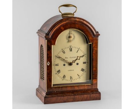 A GEORGE III GILTMETAL-MOUNTED MAHOGANY BRACKET CLOCKRol Fawney, LondonThe break-arch case surmounted by a brass carrying han