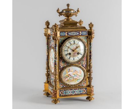 A FRENCH GILT BRASS, CLOISONNÉ ENAMEL, PORCELAIN-MOUNTED AND PASTE-SET MANTEL CLOCKCirca 1900The case with an urn finial abov