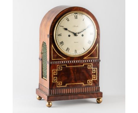A REGENCY BRASS-INLAID MAHOGANY STRIKING MANTEL CLOCKDetailed Brooks, Lynn, Circa 1815The arched case with a brass bezel and 
