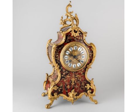 A GILTMETAL-MOUNTED BOULLE-WORK INLAID MANTEL CLOCKIn the Louis XV style, circa 1900The shaped case with cast foliate mounts,