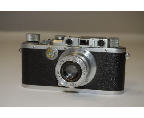 A Leica IIIa Rangefinder Camera, serial no. 300804, chrome, body, F-G, some brassing, shutter faulty, with a 5cm f/3.5 Elmar 