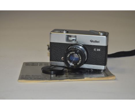 A Rollei 35 C Compact 35mm Camera,  silver, german model, with a Carl Zeiss Triotar 40mm f/3.5 lens, no. 5073787, complete wi