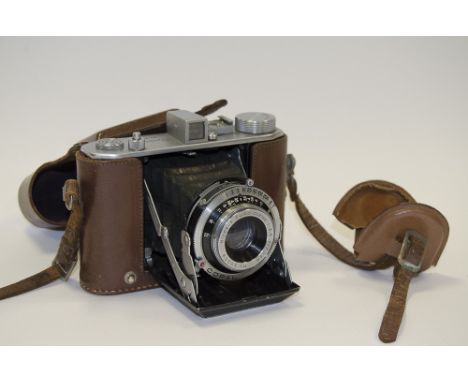 A Olympus Six I Folding Camera,  serial no. 34899, chrome, with Copal shutter, working, small patch of leatherette missing, w