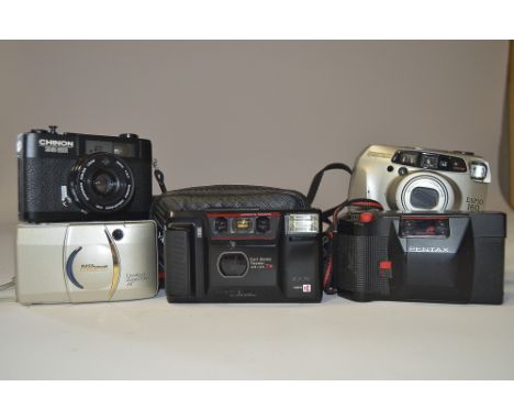 Compact Cameras, including a Yashica T DX with Carl Zeiss Tessar 35mm f/3.5 lens, a Nikon light touch and 3 other examples.