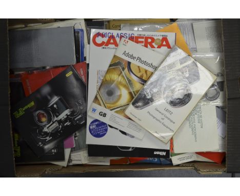 A Collection of Camera Manuals,  from manufacturers including Nikon, Minolta, Leica and Canon
