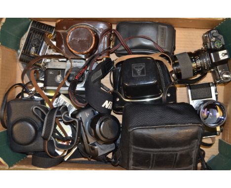 A Tray of Assorted Cameras,  including SLRs; Pentax S1, Praktica B100 and a Canon FT body, a Fujica 35 auto-m rangefinder, a 