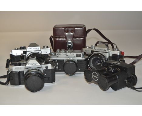 35mm SLR Cameras, including a Canon AE-1  with 50mm f/1.8 FD lens, a Zorki 4, Praktica MTL3, LTL, lot also includes a pair of