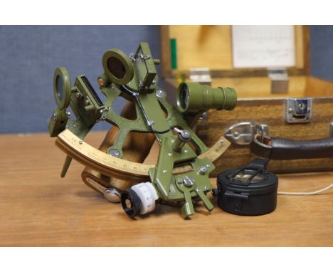 A Toizaki & Co. Sextant,  serial no. 7208, green paint with wooden handle and wooden maker's case, together with a Francis Ba