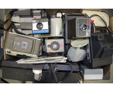 A Collection of Polaroid Land Cameras,  a variety of models from across the decades, together with an unopened film and a fla