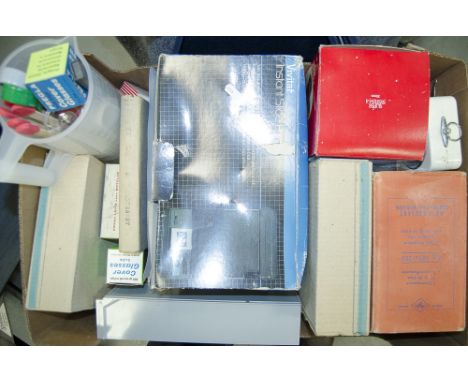 A Tray of Darkroom Equipment and Slide Accessories,  a darkroom timer clock, a 35mm developing tank, tongs, measuring beakers