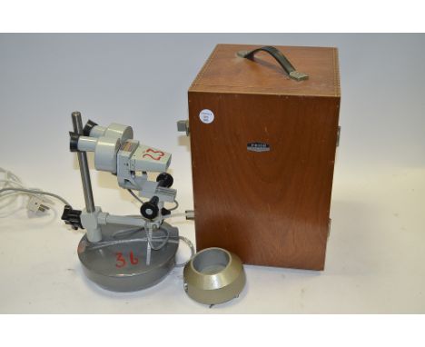 A Prior Electronic Binocular Microscope, grey enamel finish, serial no. 31332, with 20x magnification, with additional bulbs 