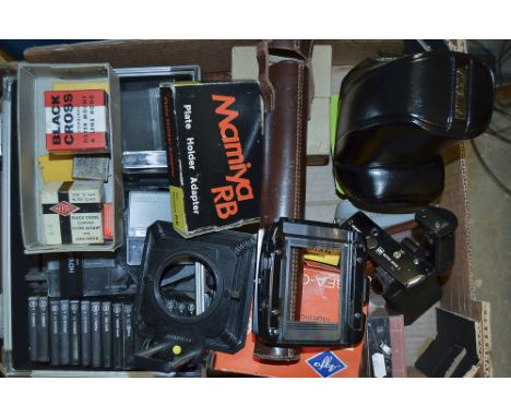 A Tray of camera Accessories, including Hasselblad bellows (1), Mamiya RB plate holder adaptor, Olympus OM motor drive, an al