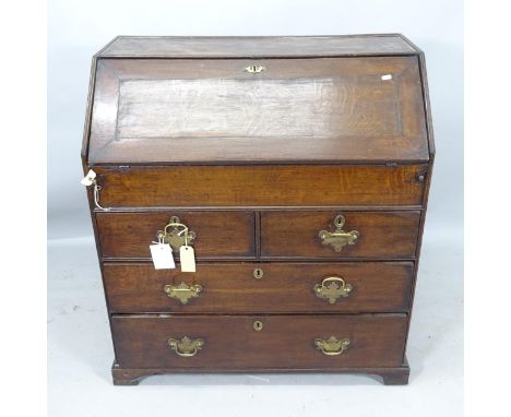 A Georgian oak bureau, with well fitted interior, and 2 short and 2 long drawers, on bracket feet, 92cm x 104cm x 54cm 