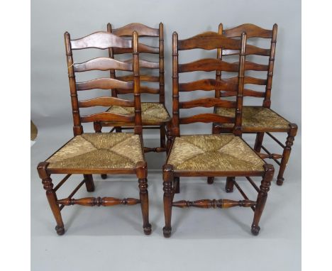 A set of 4 reproduction rush-seated ladder-back dining chairs 