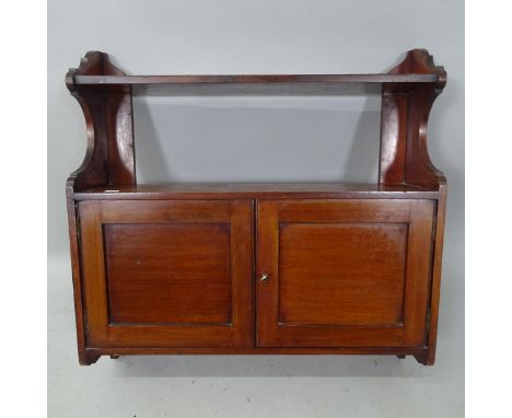 An Edwardian mahogany hanging shelf with 2 panelled doors, 60cm x 60cm x 15cm 