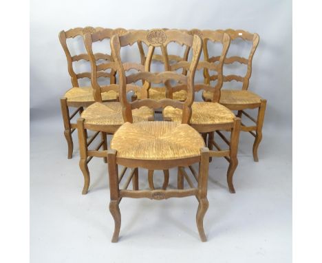 A set of 6 French oak rush-seated ladder-back dining chairs 