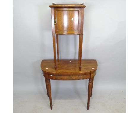 A Victorian mahogany demilune fold over card table, 92cm x 74cm x 45cm, and an Edwardian mahogany pot cupboard, 39cm x 86cm x