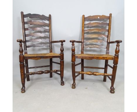 A pair of north country style rush-seated ladder-back open-arm chairs 