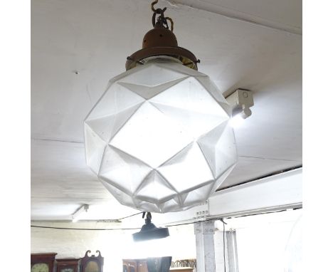 A faceted glass-bowled pendant light 