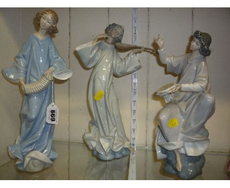 THREE LLADRO MUSICAN FIGURES, playing an accordion, tambourine etc (one missing a bow)