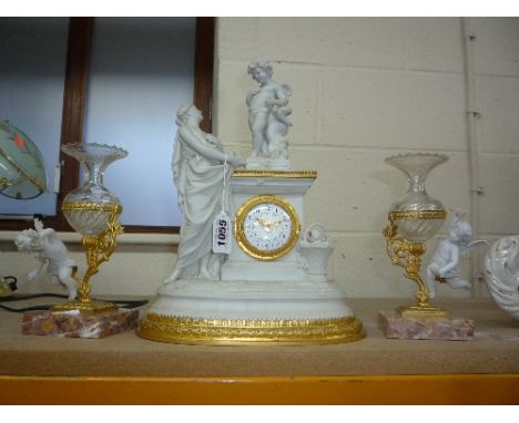 A BISQUE/GILT/GLASS CLOCK GARNITURE, (cherubs loose)