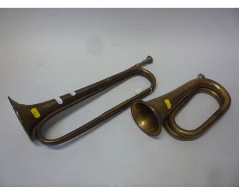 A BRASS BUGLE, with silvered mouth piece and another similar (2)