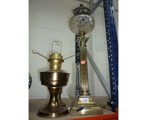 A BRASS OIL LAMP, with glass well and funnel and two others (3)