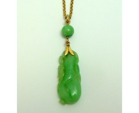 A PENDANT AND NECKLACE, of carved jade with a further sphere of jade suspended from a belcher chain, stamped 375, length 38cm