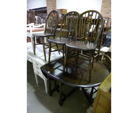 A PRIORY OAK GATE LEG TABLE, and four matching wheel back chairs (5)