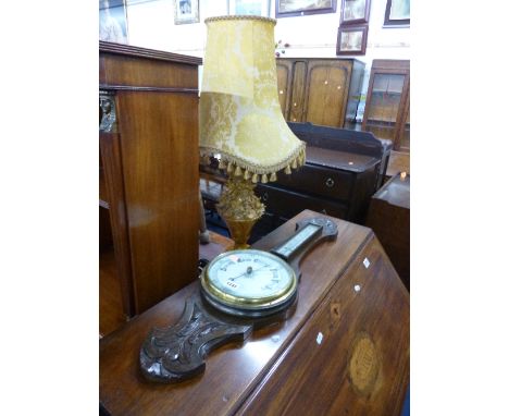 A CARVED OAK ANEROID BAROMETER, and a table lamp with shade (2)
