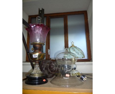 A BRASS OIL LAMP, with glass shade and various other lamps, shade etc