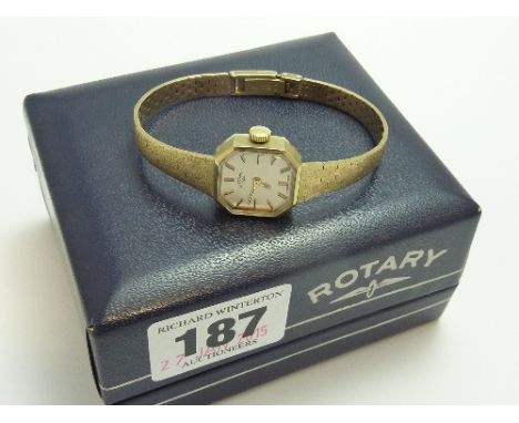 A LADIES 9CT GOLD ROTARY WRISTWATCH, with Hexagen shape face to the gold tapered strap and clasp