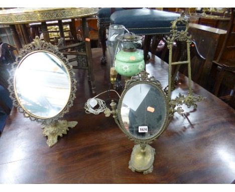 TWO BRASS FRAMED TABLE SWING MIRRORS, an easel and an oil lamp (s.d.) (4)