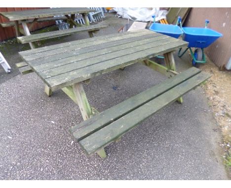 A LARGE WOODEN PICNIC BENCH
