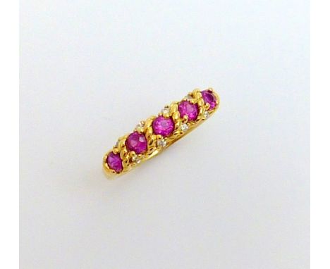 AN 18CT GOLD RUBY AND DIAMOND RING, the five rubies with rope twist detail and diamond accents, stamped 750, ring size Q1/2