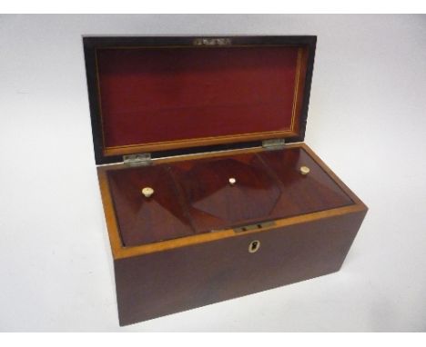 A 19TH CENTURY MAHOGANY TEA CADDY, lidded compartments and space for mixing bowl