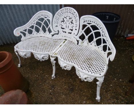 A CAST METAL THREE SEATER GARDEN BENCH