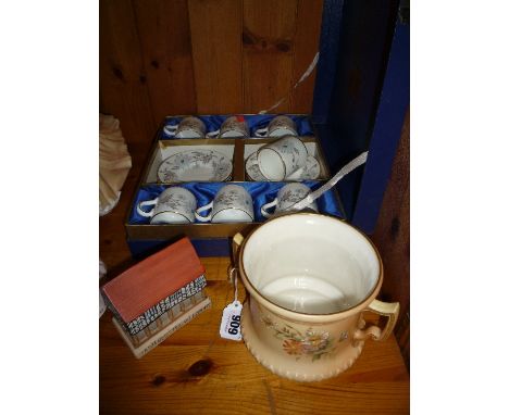 A GRAINGER WORCESTER BLUSH IVORY LOVING CUP, a boxed set of Coalport coffee cans and saucers and a porcelain model 'Old Marke