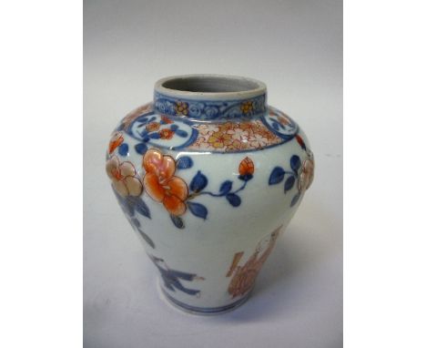 A CHINESE IMARI VASE, first half 19th Century, of baluster shape, modelled with flowers to the shoulder and painted in underg