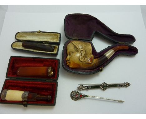 THREE CHEROOTS, a pipe and two brooches (6)