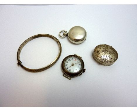 A COLLECTION OF SILVER ITEMS, to include a silver sovereign holder, a silver pill box, a hinged bangle and a watch face