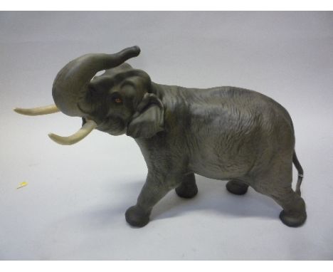 A BESWICK ELEPHANT, with trunk in salute, No.1770, matt