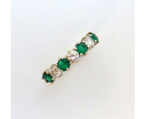 AN 18CT GOLD DIAMOND AND EMERALD RING, estimated total diamond weight 0.45cts, ring size K