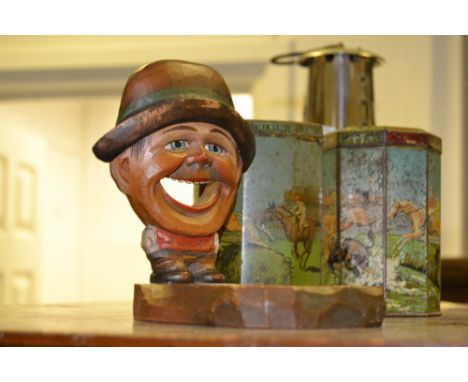 An unusual early 20th century Black Forest type carved and painted novelty pipe stand, as a comical man 