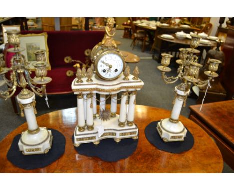 A French Second Empire ormolu and alabaster portico clock garniture, 7.5cm convex enamel dial inscribed with Arabic numerals 