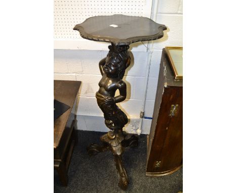 A 19th century giltwood and ebonised torchere stand, the shaped rectangular top with chiselled moulded edge, raised on an aca