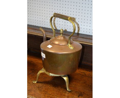 A Victorian copper kettle;  a brass trivet